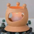 Creative Co-Op Handmade Terracotta Candle Holder with Circle of Figures