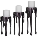 CosmoLiving by Cosmopolitan Aluminum Metal Decorative Candle Holder Pillar Candle Stand with Dripping Melting Designed Legs, Set of 3 Candlestick Holder 12", 10", 8"H, Black - color: Black