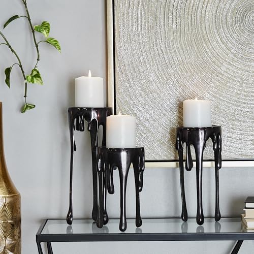 CosmoLiving by Cosmopolitan Aluminum Metal Decorative Candle Holder Pillar Candle Stand with Dripping Melting Designed Legs, Set of 3 Candlestick Holder 12", 10", 8"H, Black - color: Black
