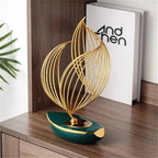 BOWERY HILL Gold Resin Geometric Metal Sculpture, 6.69" L x 3.5" W x 11.61" H, Abstract Twisted Design, Modern Tabletop Decor for Living Room, Office, or Shelves, Durable and Elegant Finish